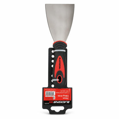 Stainless steel filling knife on wooden surface