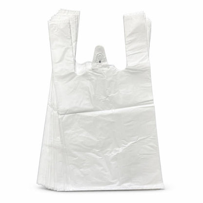 Stack of white plastic carrier bags on a grey carpet