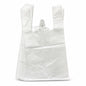 Stack of white plastic carrier bags on a grey carpet